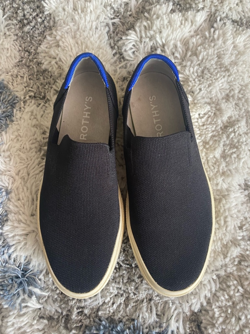Rothy's Black Slip-On Sneakers with Blue Trim